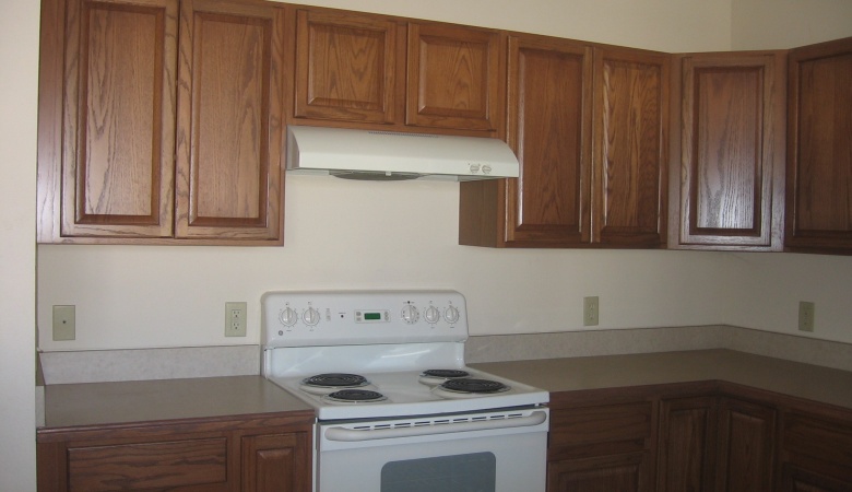 Stove, countertop and cabinetry