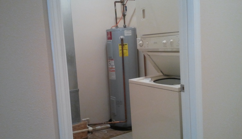 Laundry with stacked washer & dryer